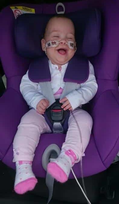 BRAVE ELLA IS ‘SAFE, SECURE AND HAPPY’ IN HER SPECIAL CAR SEAT