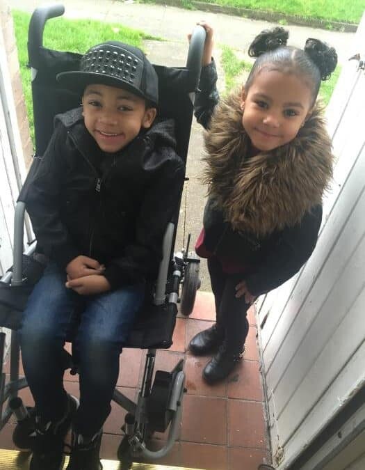 WITH A SPECIAL BUGGY TO KEEP HIM SAFE, RIO AND HIS FAMILY HAVE MORE FREEDOM